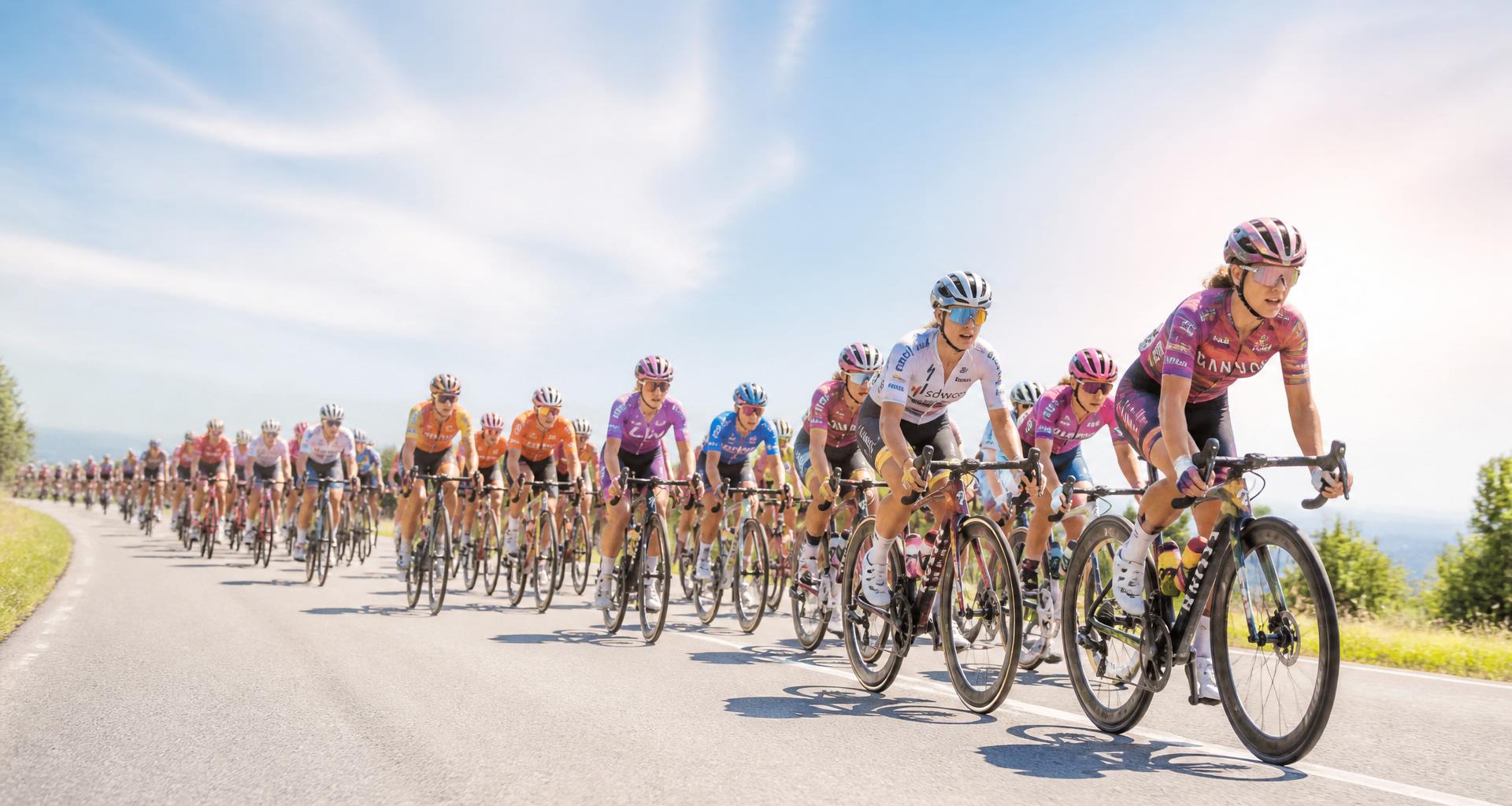 Women's professional road cycling peloton racing on an open road